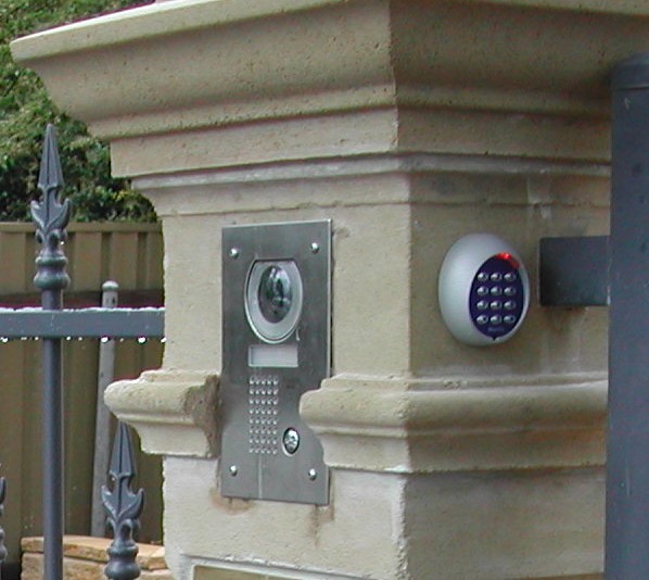 intercom and camera on fence